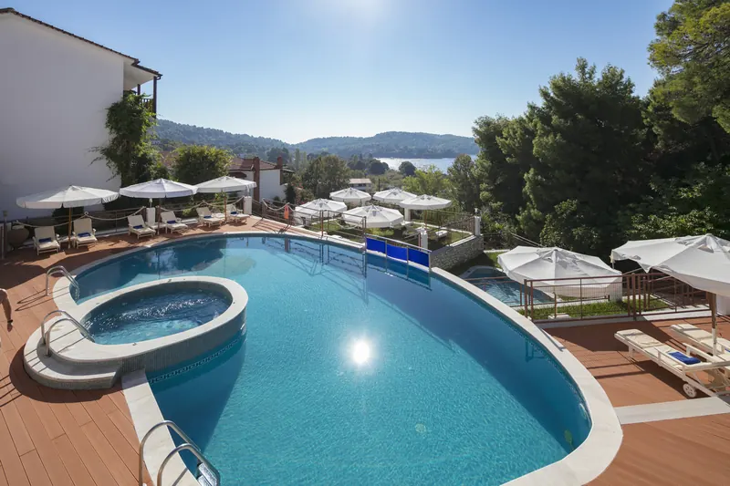 The pool and sun loungers in the morning sun